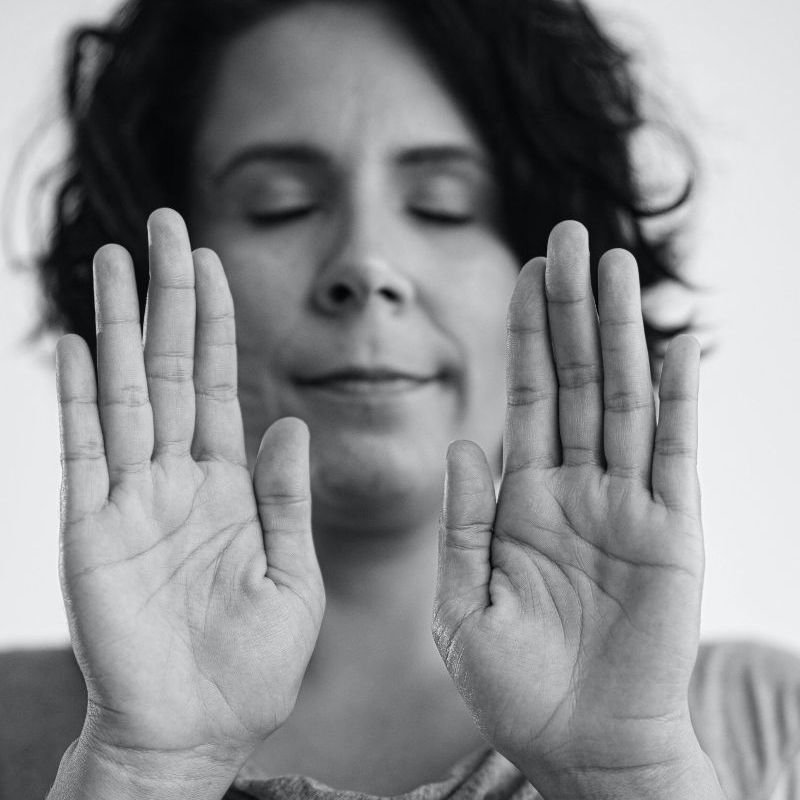 Woman beaming Reiki