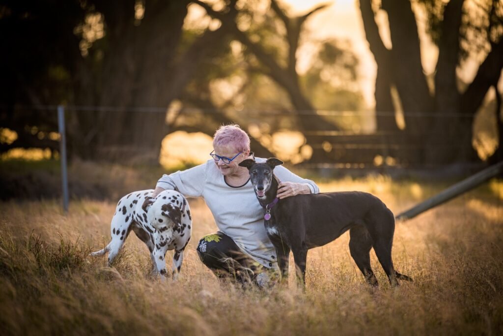Noelene with her two dogs - Dalmation Meg and Greyhound Daphne on her property